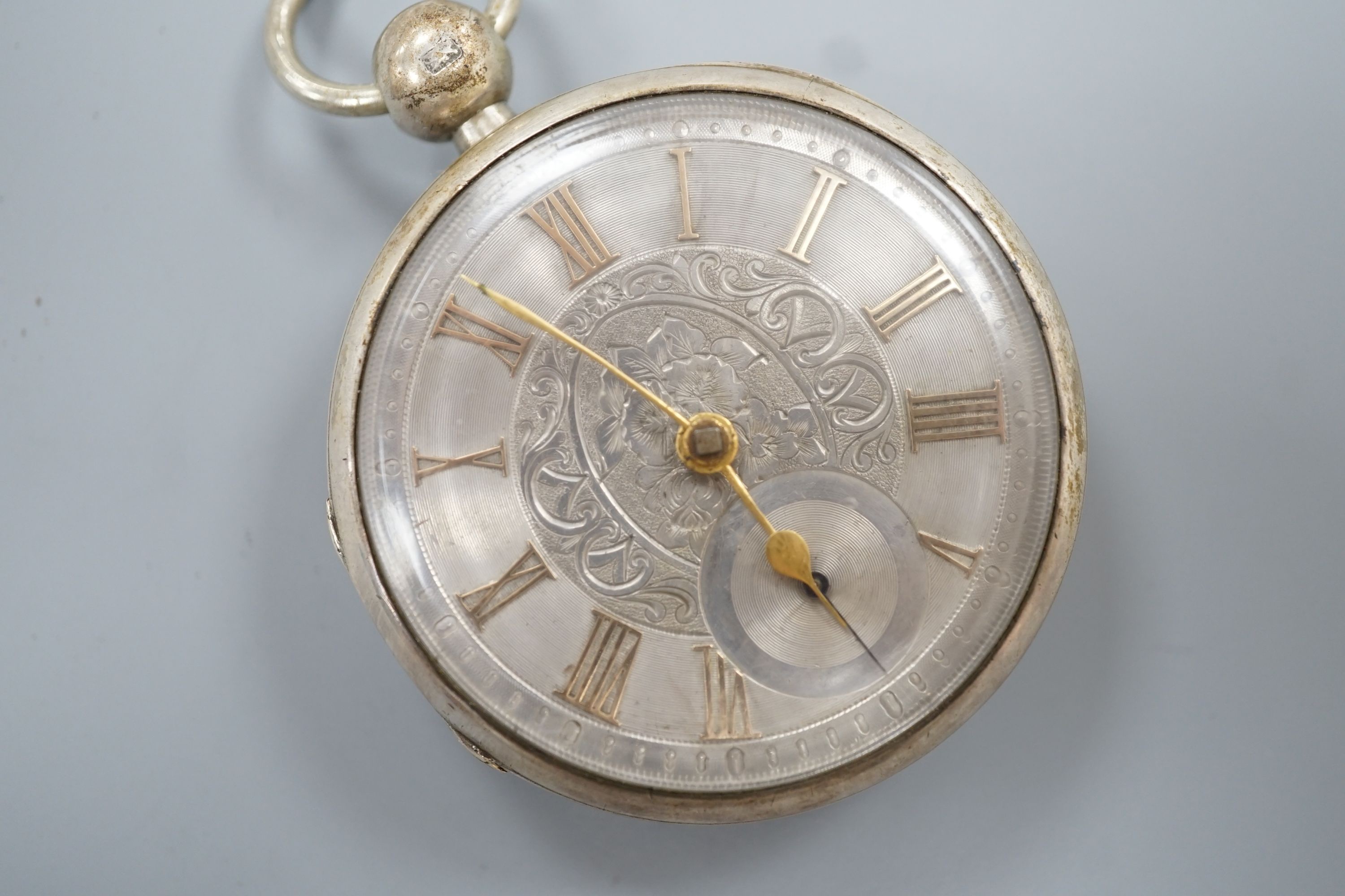 A Victorian engine turned silver open face keywind pocket watch, with gilt numeral Roman dial, case diameter 50mm.